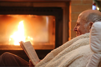 Elder man reading a book
